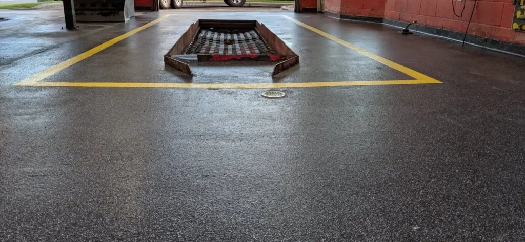 Coated floor of a car mechanic shop